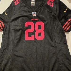 NFL Black Jersey with Red and Gold Details